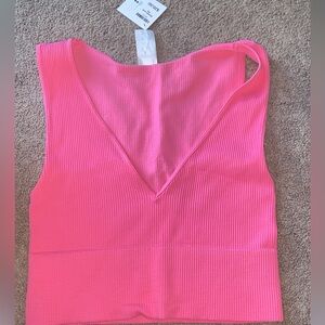 Beautiful pink tank bought from a boutique shop. It is one size fits all.